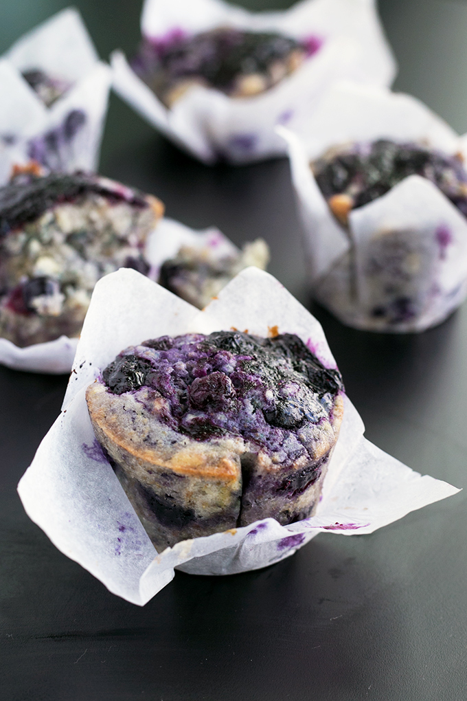 Loaded Vegan Blueberry Muffins - Fully loaded Vegan Blueberry Muffins with a lemon zest topping and homemade Blueberry Jam Swirl. #vegan #muffins #healthy #breakfast #foodporn