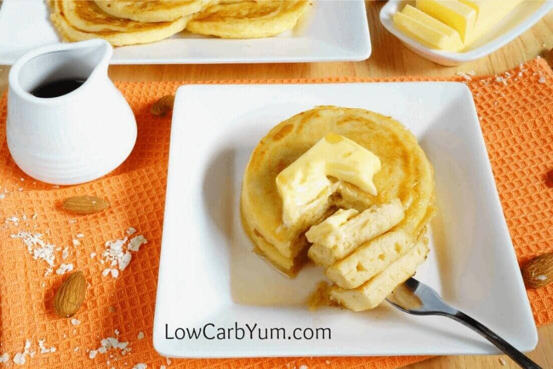 An easy recipe for fluffy gluten free low carb coconut flour pancakes. Such a tasty breakfast treat! Enjoy them with your favorite syrup or eat them plain. | LowCarbYum.com