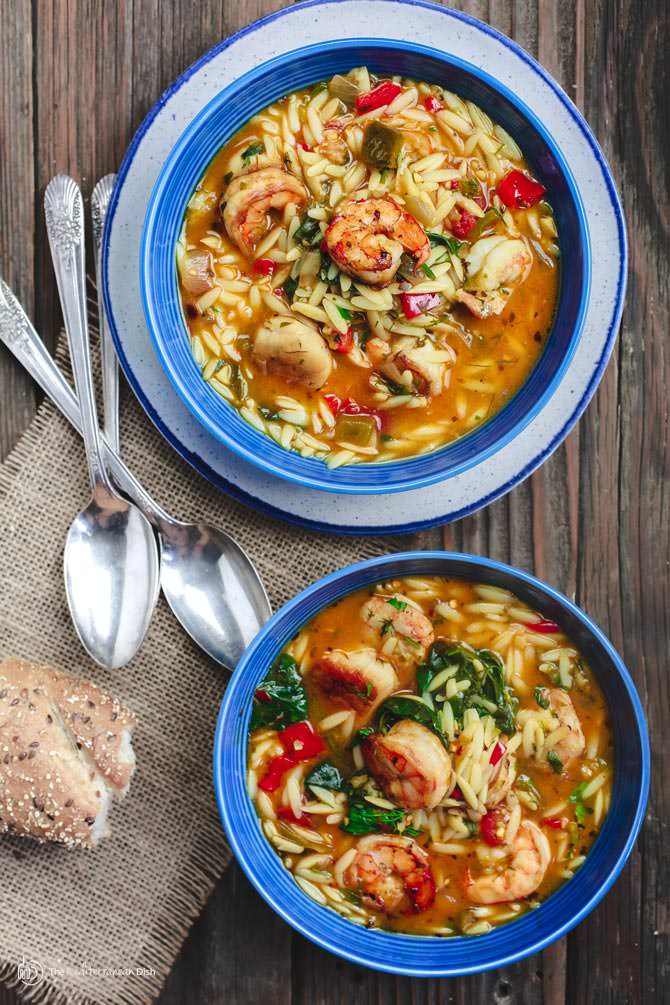 Mediterranean Shrimp Orzo Soup | The Mediterranean Dish. A hearty and healthy orzo soup with vegetables and shrimp. Fresh parsley, dill and oregano give it a wonderful Italian flavor. See this Mediterranean recipe on TheMediterraneanDish.com