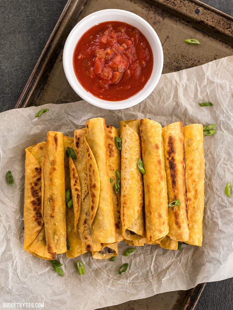 Creamy Black Bean Taquitos are an easy and tasty party treat for football games or just for fun! BudgetBytes.com