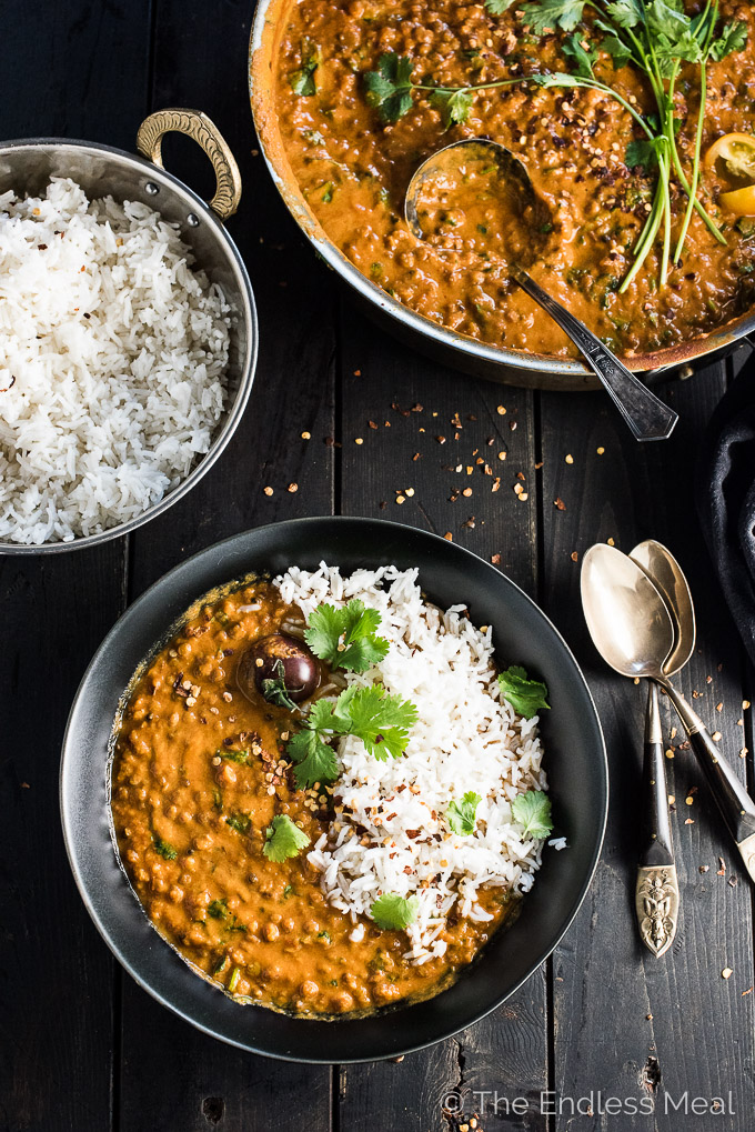 This easy to make Creamy Coconut Lentil Curry takes less than an hour to make (mostly hands off time) and is packed full of delicious Indian flavors. It's a healthy vegan recipe that makes a perfect meatless Monday dinner recipe. Make extras and you'll have a giant smile on your face at lunch the next day. | theendlessmeal.com