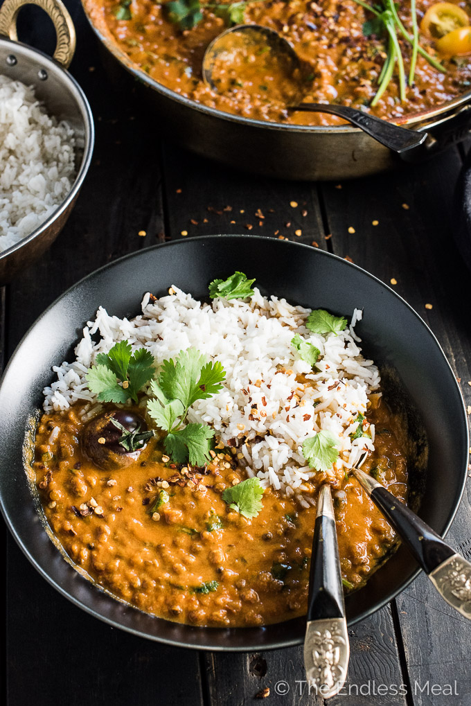 This easy to make Creamy Coconut Lentil Curry takes less than an hour to make (mostly hands off time) and is packed full of delicious Indian flavors. It's a healthy vegan recipe that makes a perfect meatless Monday dinner recipe. Make extras and you'll have a giant smile on your face at lunch the next day. | theendlessmeal.com
