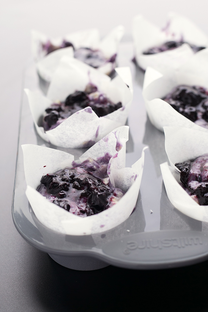 Loaded Vegan Blueberry Muffins - Fully loaded Vegan Blueberry Muffins with a lemon zest topping and homemade Blueberry Jam Swirl. #vegan #muffins #healthy #breakfast #foodporn