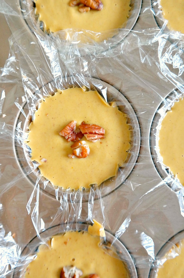 Mini Vegan Pumpkin Pie Cheesecakes - Rich & Creamy (but not too sweet) Pumpkin Pie Bites. Simple and perfect for Fall parties or Thanksgiving. Gluten Free + Flourless. From The Glowing Fridge.