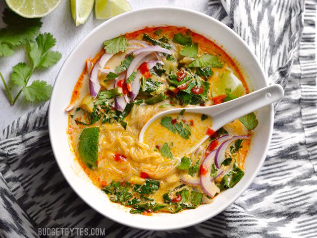 Thai Curry Vegetable Soup is packed with vegetables, spicy Thai flavor, and creamy coconut milk. BudgetBytes.com